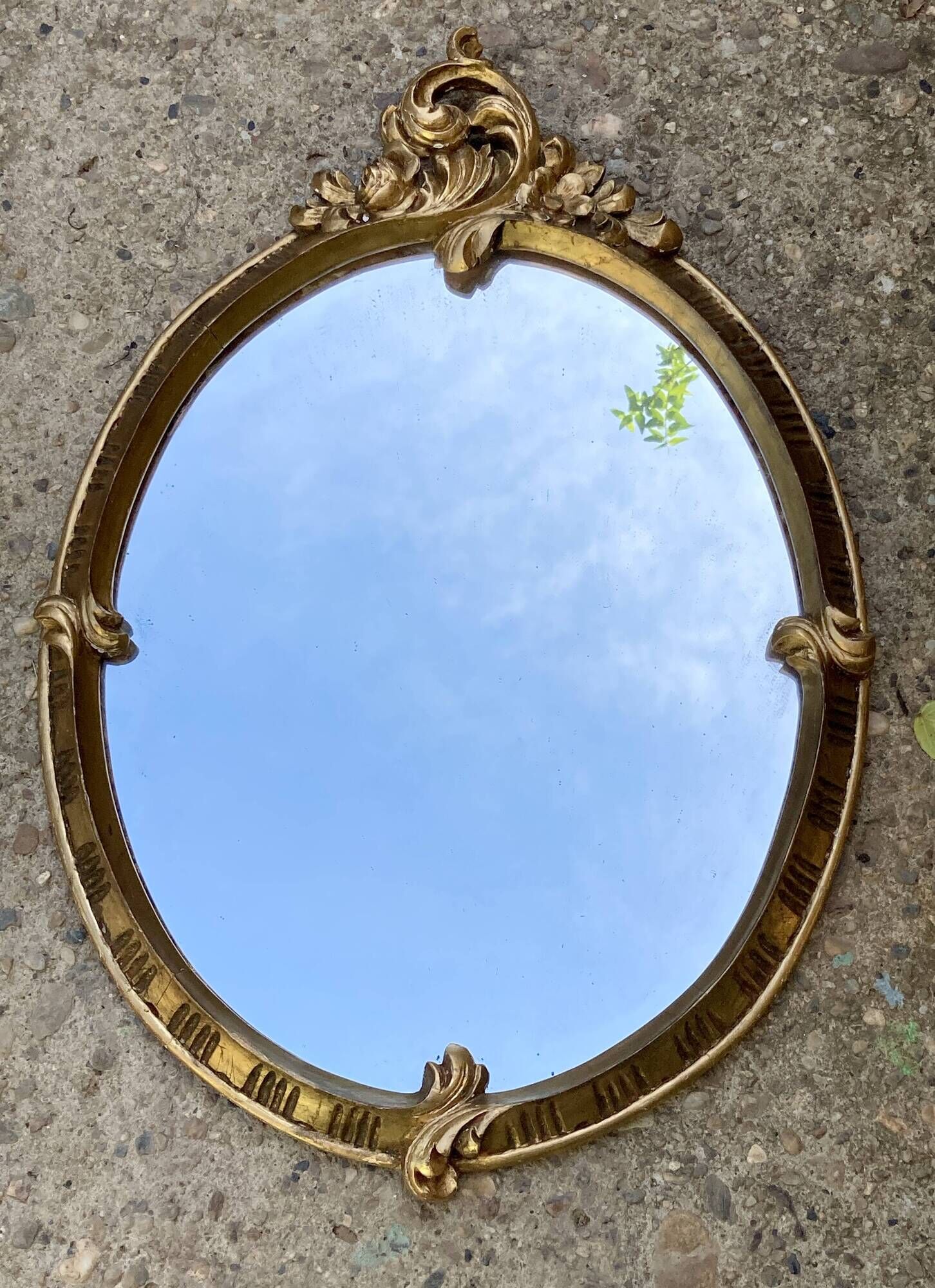 Oval mirror - wood and gilded stucco with decoration of