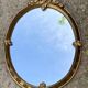 Oval mirror - wood and gilded stucco with decoration of