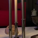 Three silver metal candle holders