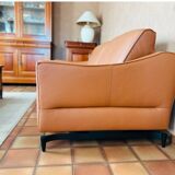 Cognac-colored leather sofa, new condition, never used due to death