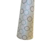 Vintage ceramic floor lamp with illuminated base.