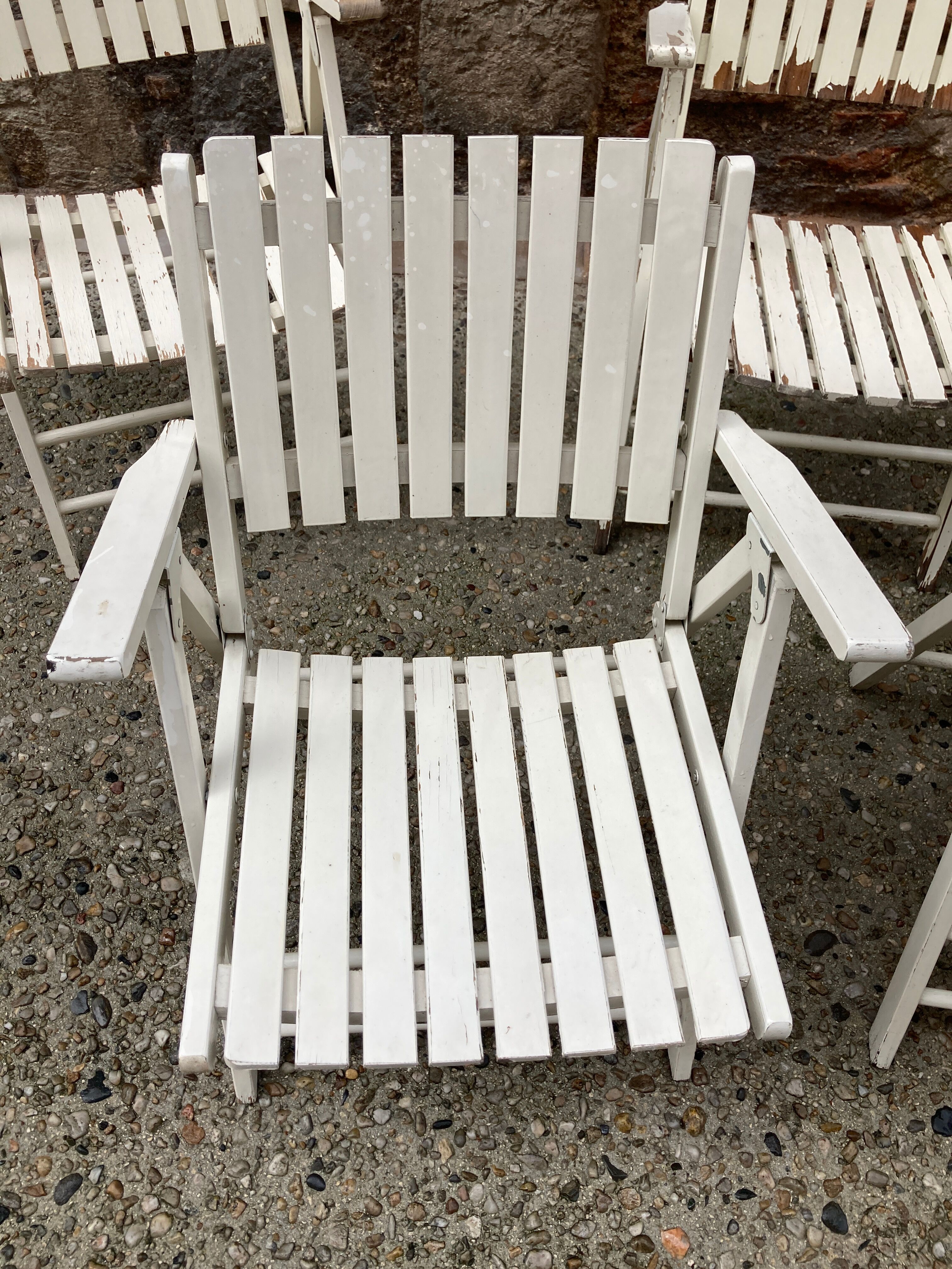 Five wooden garden armchairs