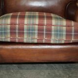 George Smith Signature Scroll leather canapé with tartan Scottish wool cushions.