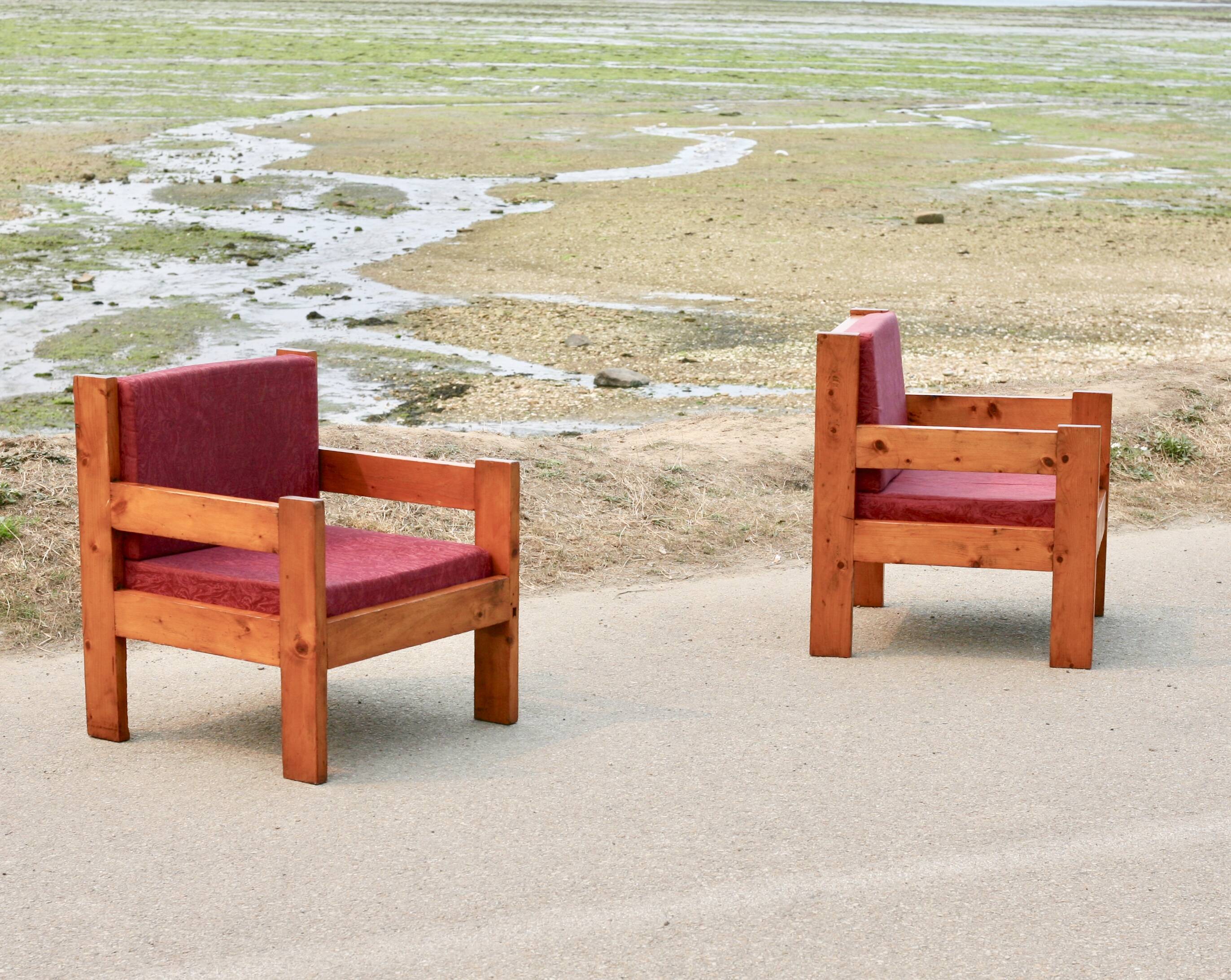 Pair of pine fireside chairs, France, 1960s, "raspberry" cushions
