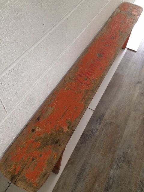 Orange folding wooden bench