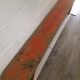 Orange folding wooden bench