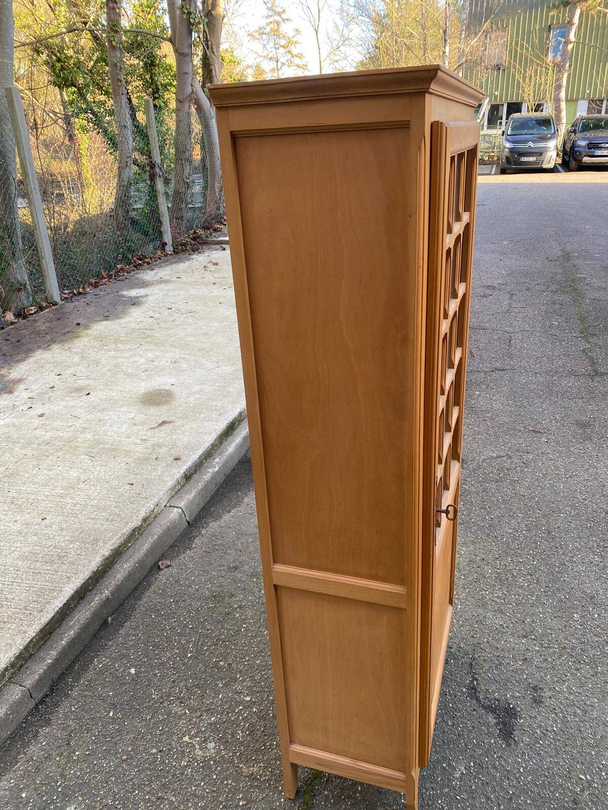 Parisian glass-fronted wardrobe in light wood from the 1960s.
