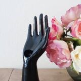 Hand holds black jewelry, ring sizer, soliflore, vintage French, 50s