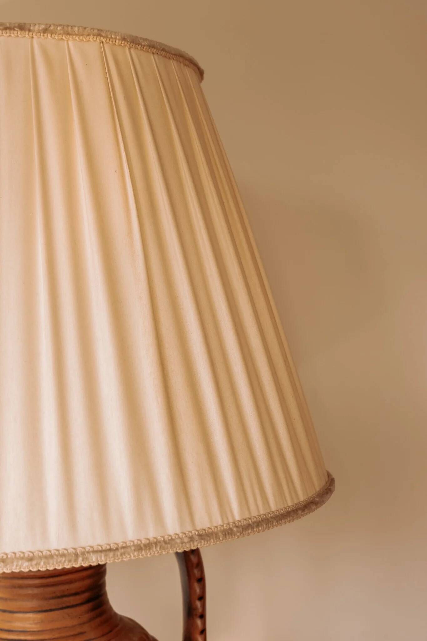 Large ceramic table lamp from West Germany with a pleated shade.