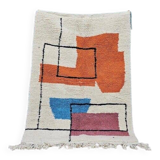 Traditional handmade wool Berber rug with colourful patterns.