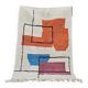 Traditional handmade wool Berber rug with colourful patterns.