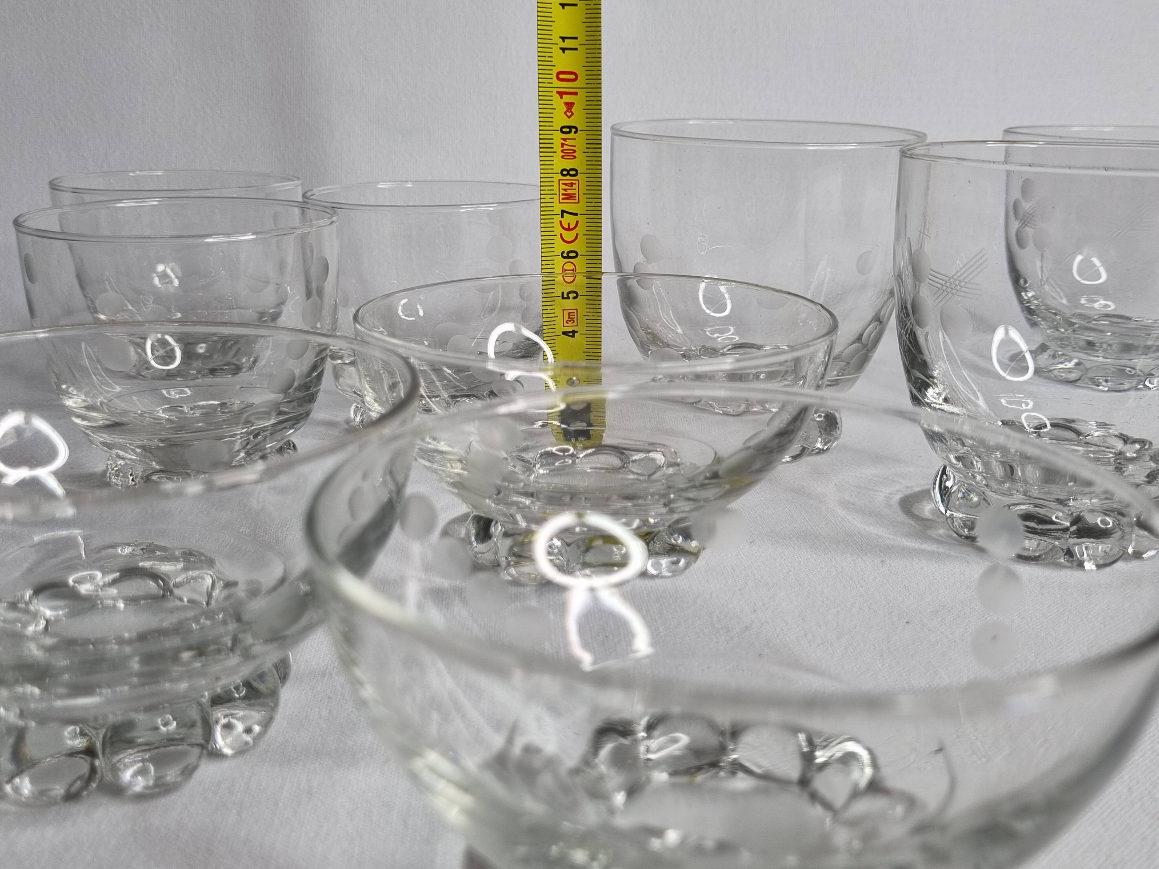 Set of Art Deco style engraved crystal bowls and glasses on spherical feet