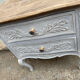 Adorable small chest of drawers or weathered white console.