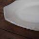 Oval octagonal dish in ecru white earthenware Moulin des Loups