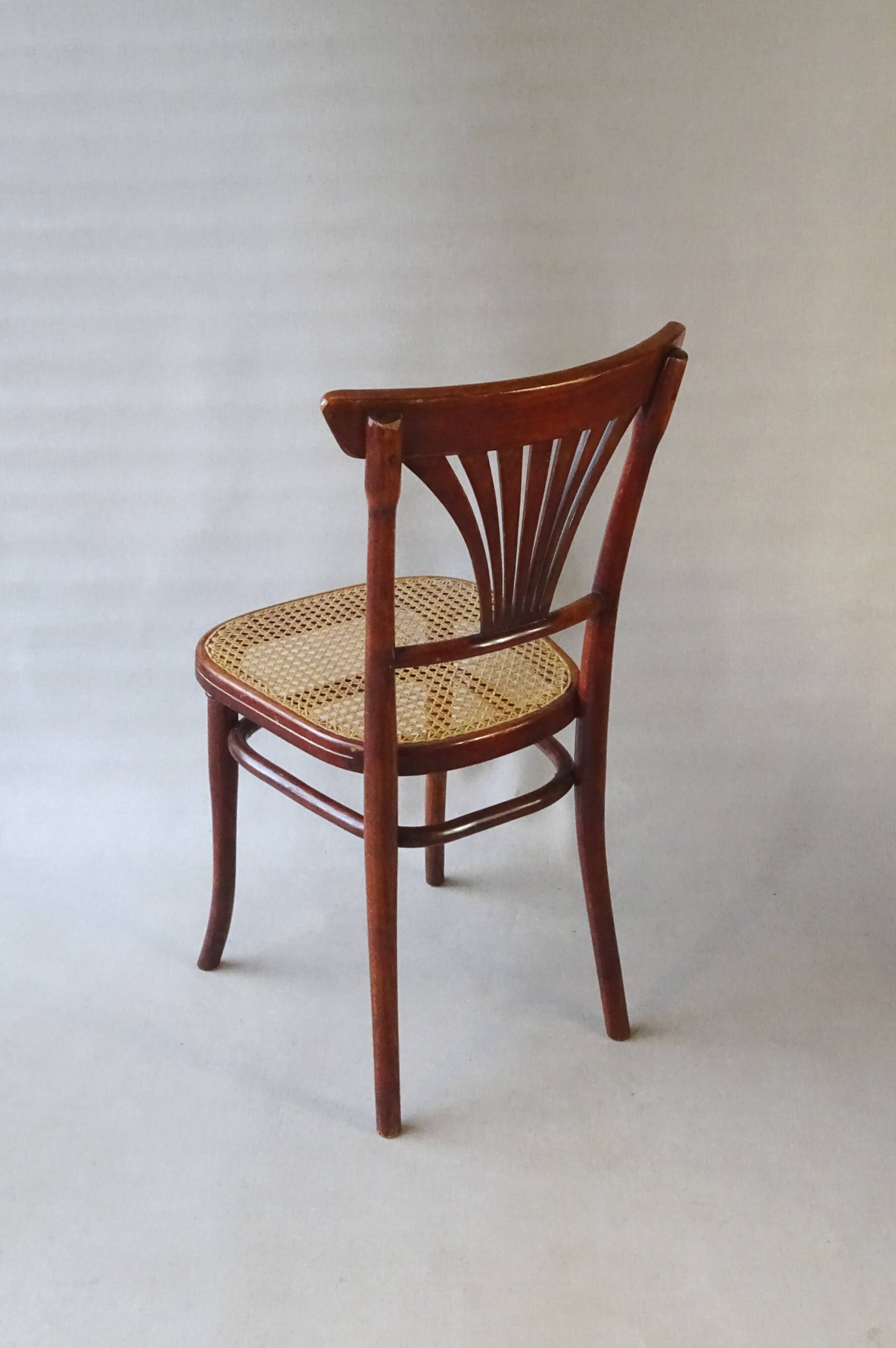 2 Thonet N°221 chairs, caned Art Nouveau bronze decor