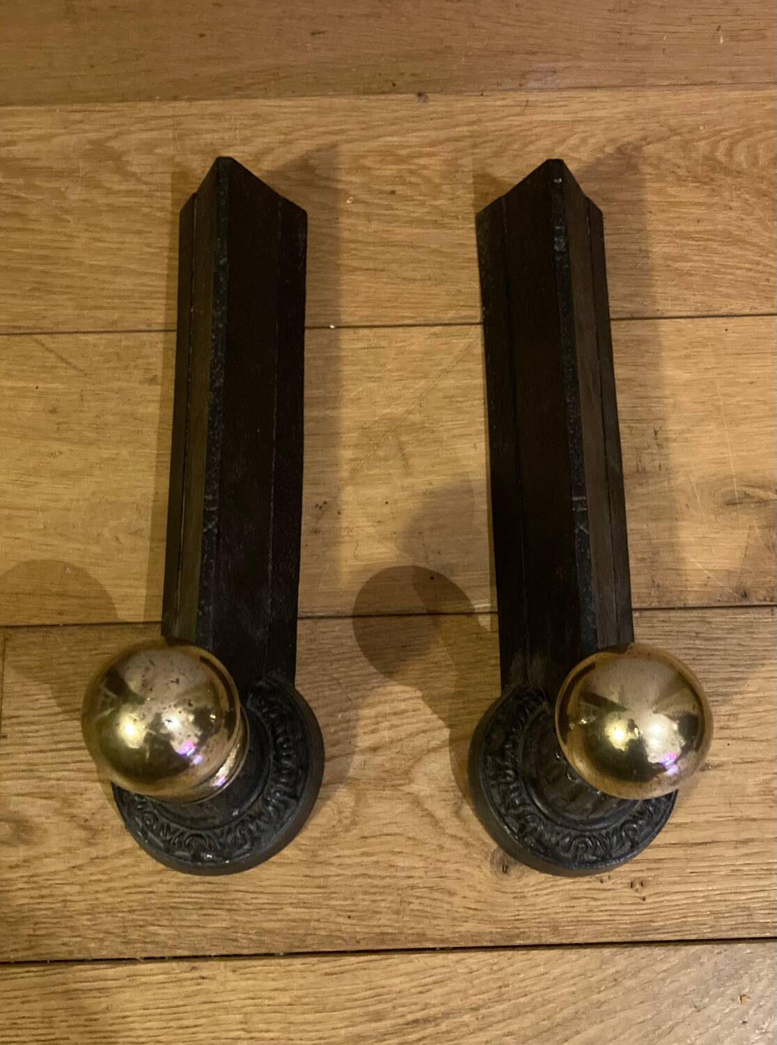 Pair of Napoleon III andirons from the 19th century in cast iron and brass
