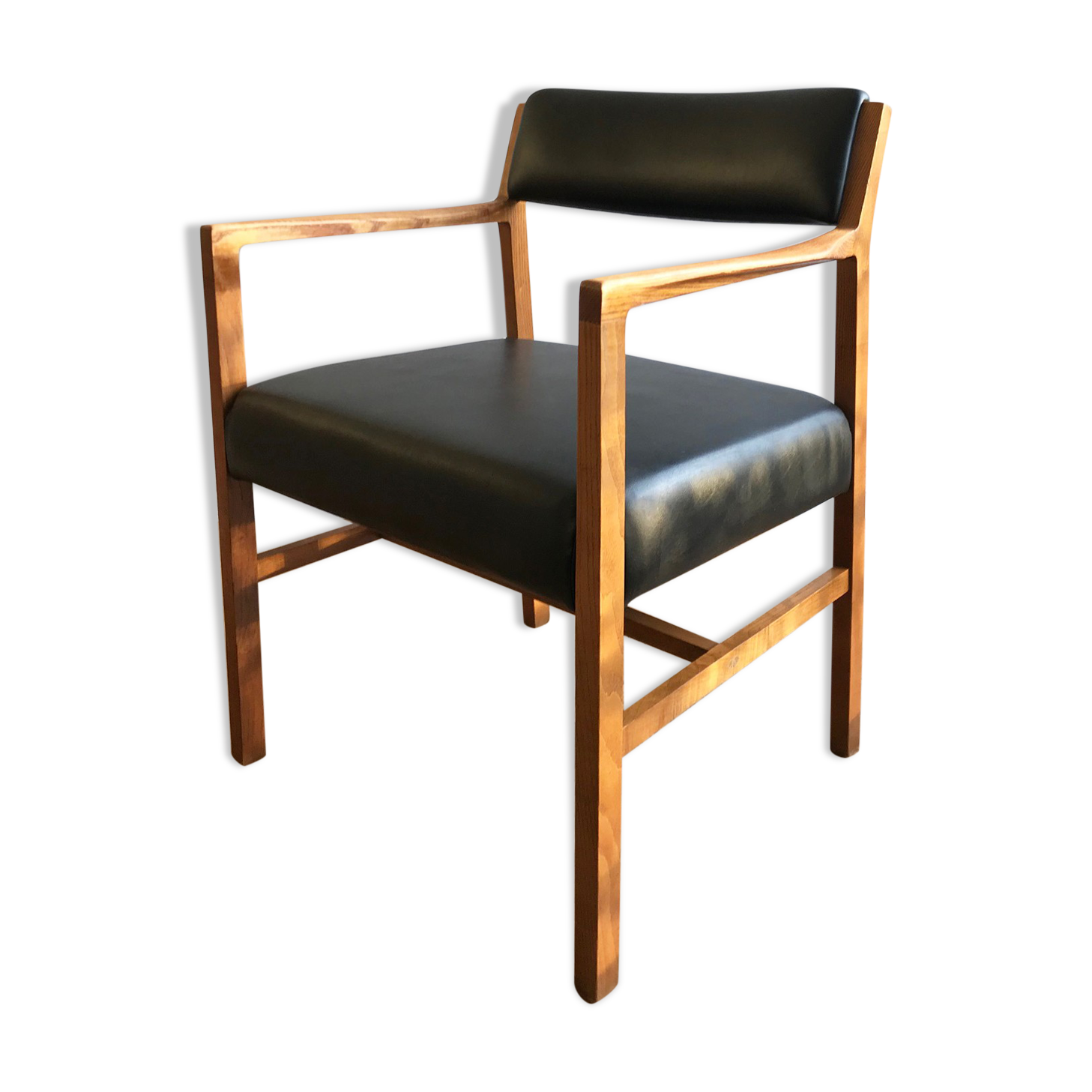 Chair in light teak and black skaï from the 1960s