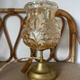Table lamp with amber glass globe and brass base