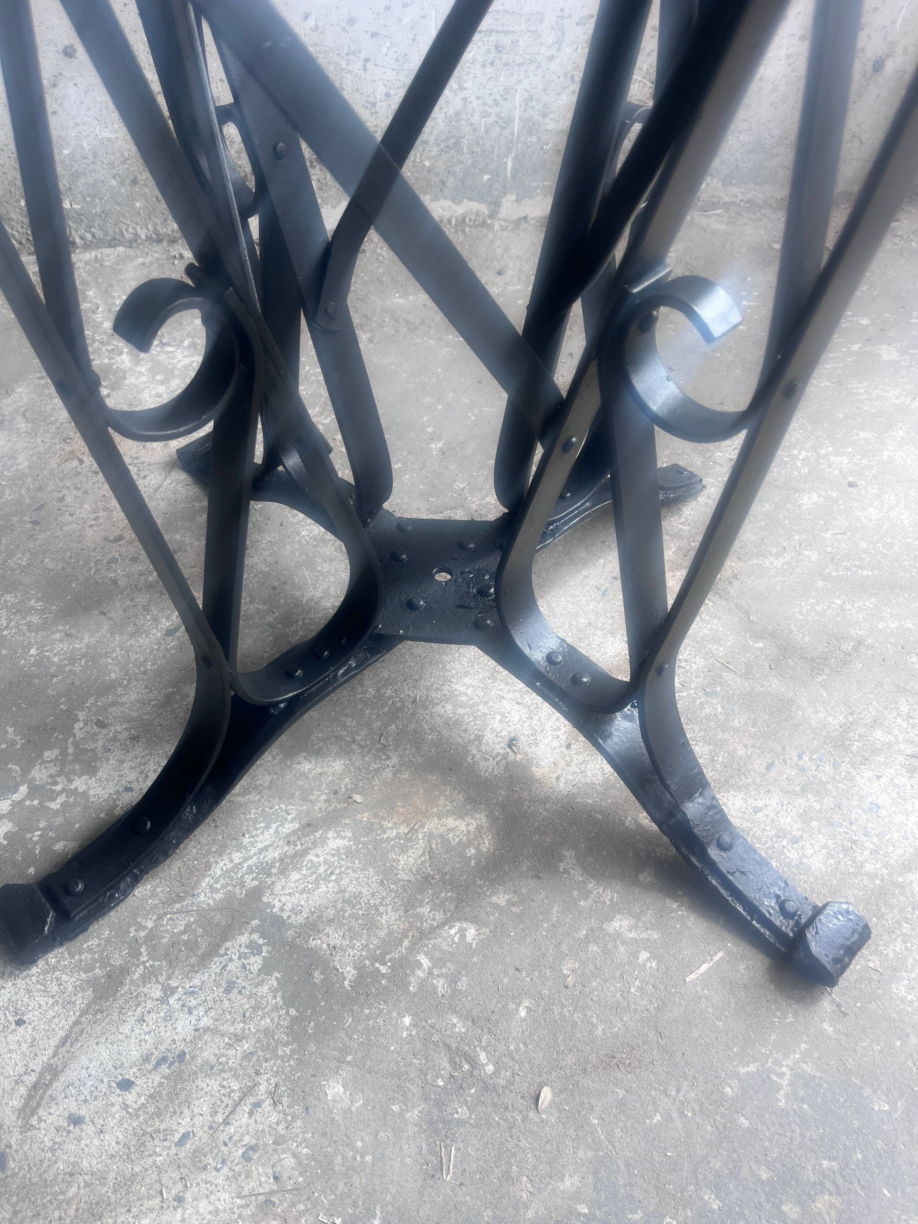 French Art Deco dining table in wrought iron and glass, circa 1930.