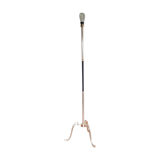 Golden and black tripod floor lamp