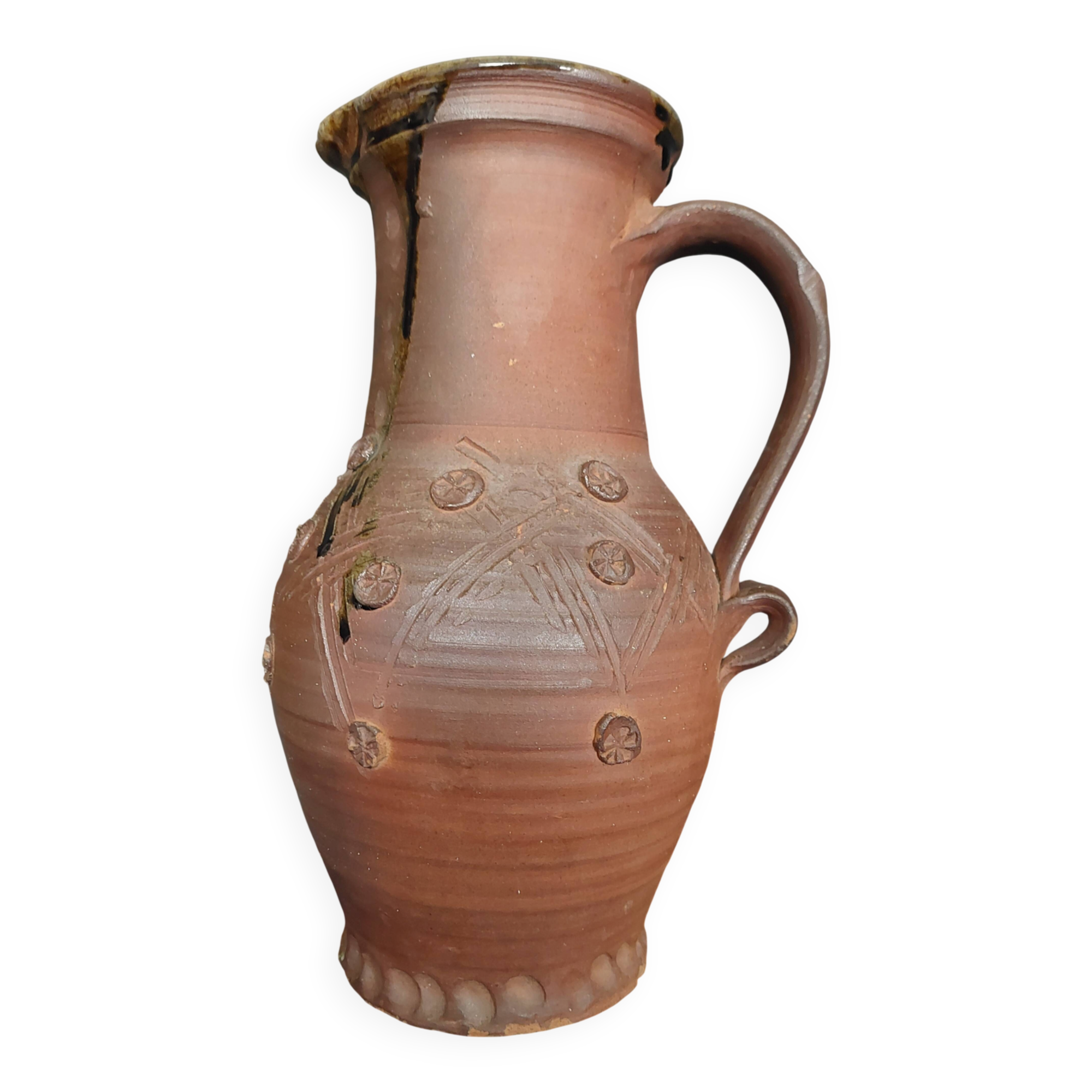 Vintage pitcher with a signature to identify.