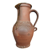 Vintage pitcher with a signature to identify.