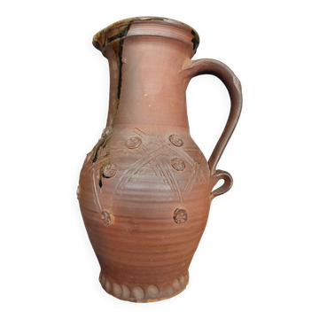 Vintage pitcher with a signature to identify.