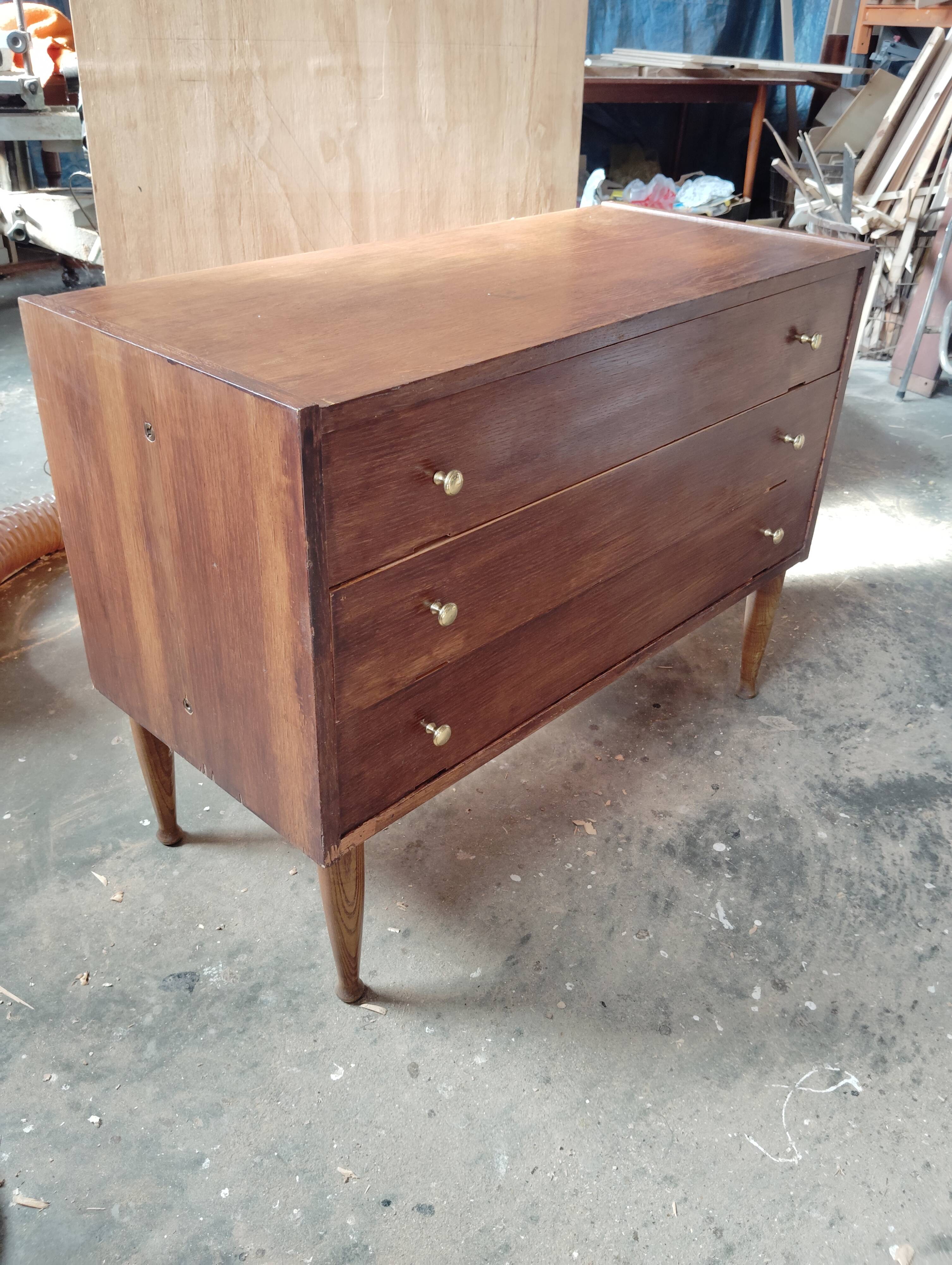 Vintage commode with tapered legs.