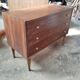 Vintage commode with tapered legs.