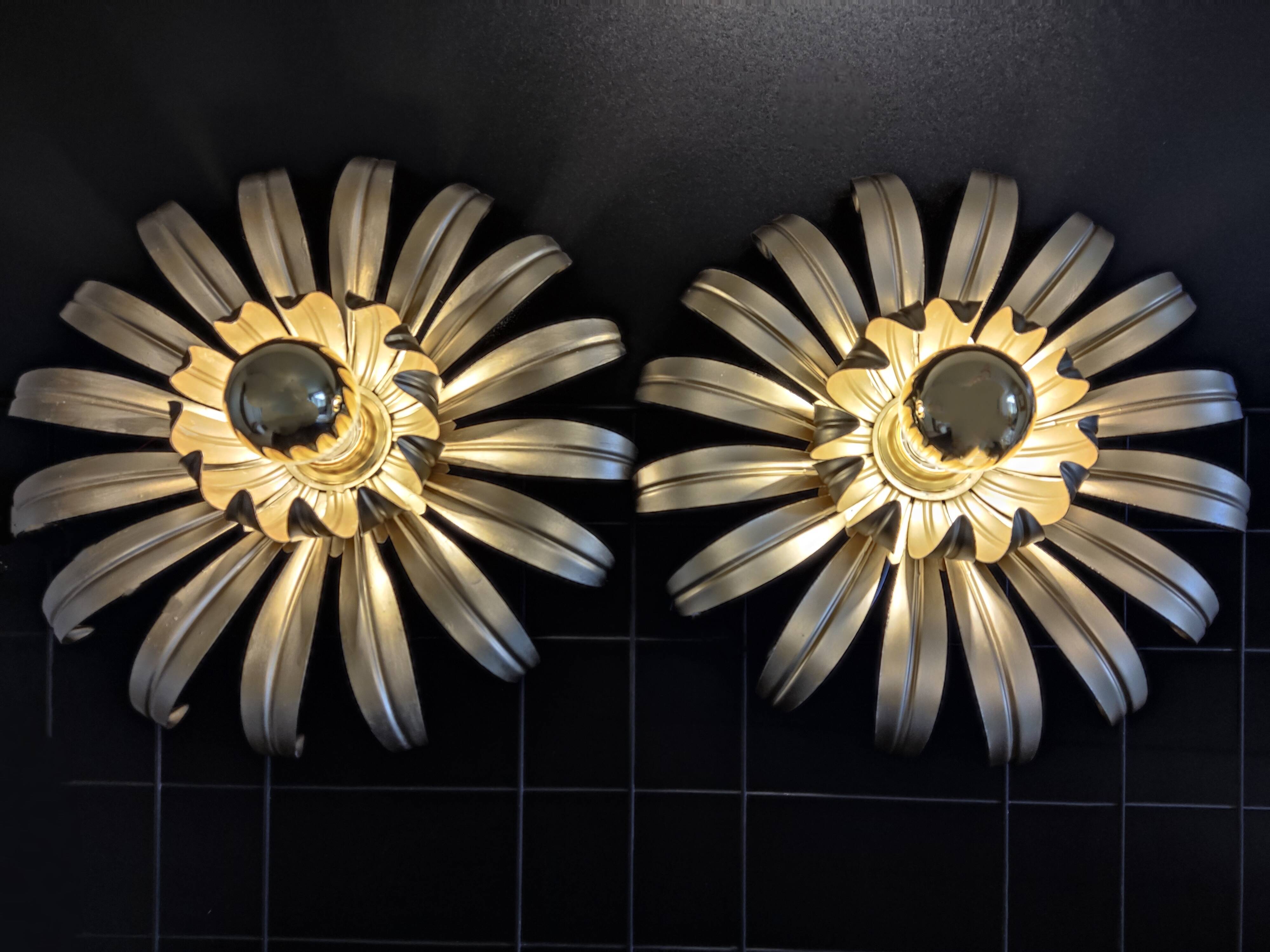 Golden metal flower sconces