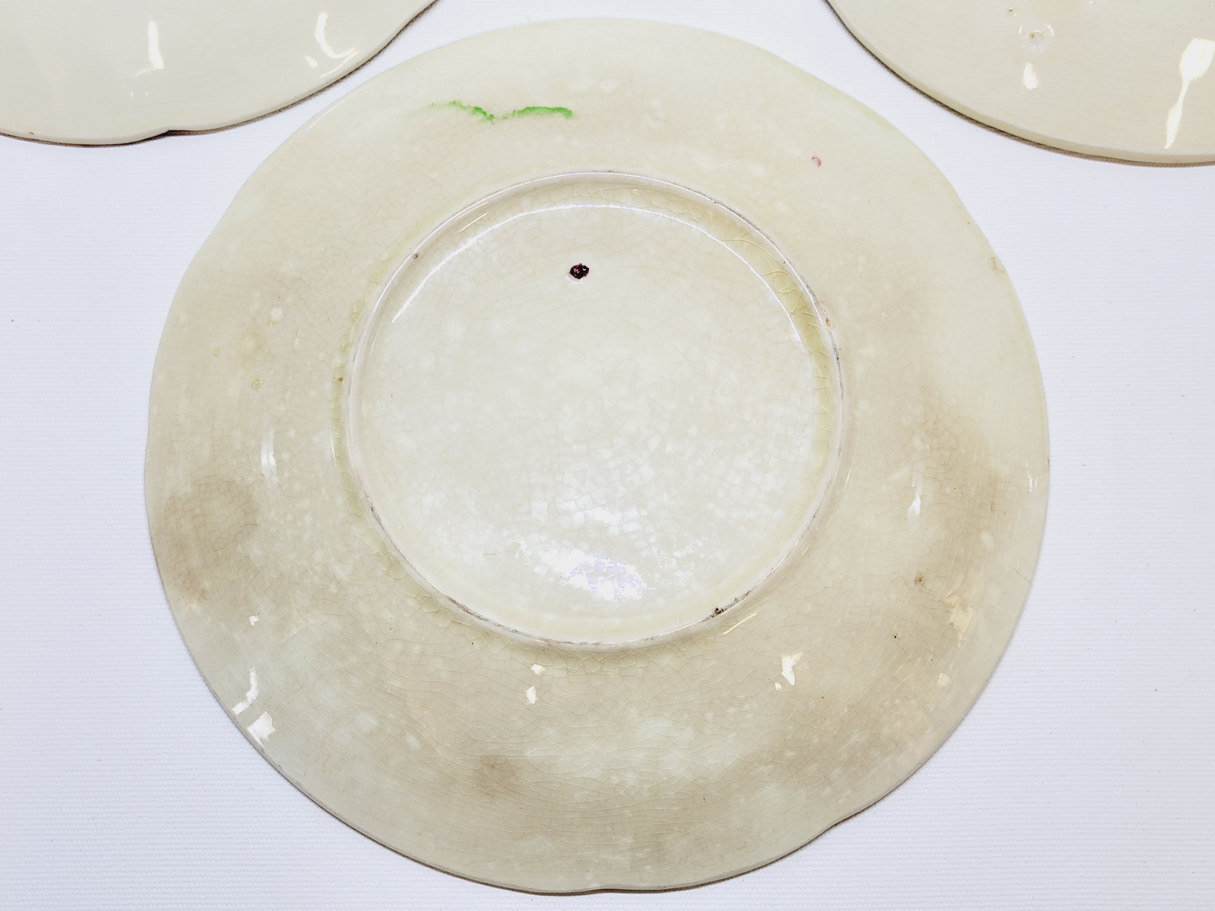 3 old plates in slip decoration strawberries and grapes