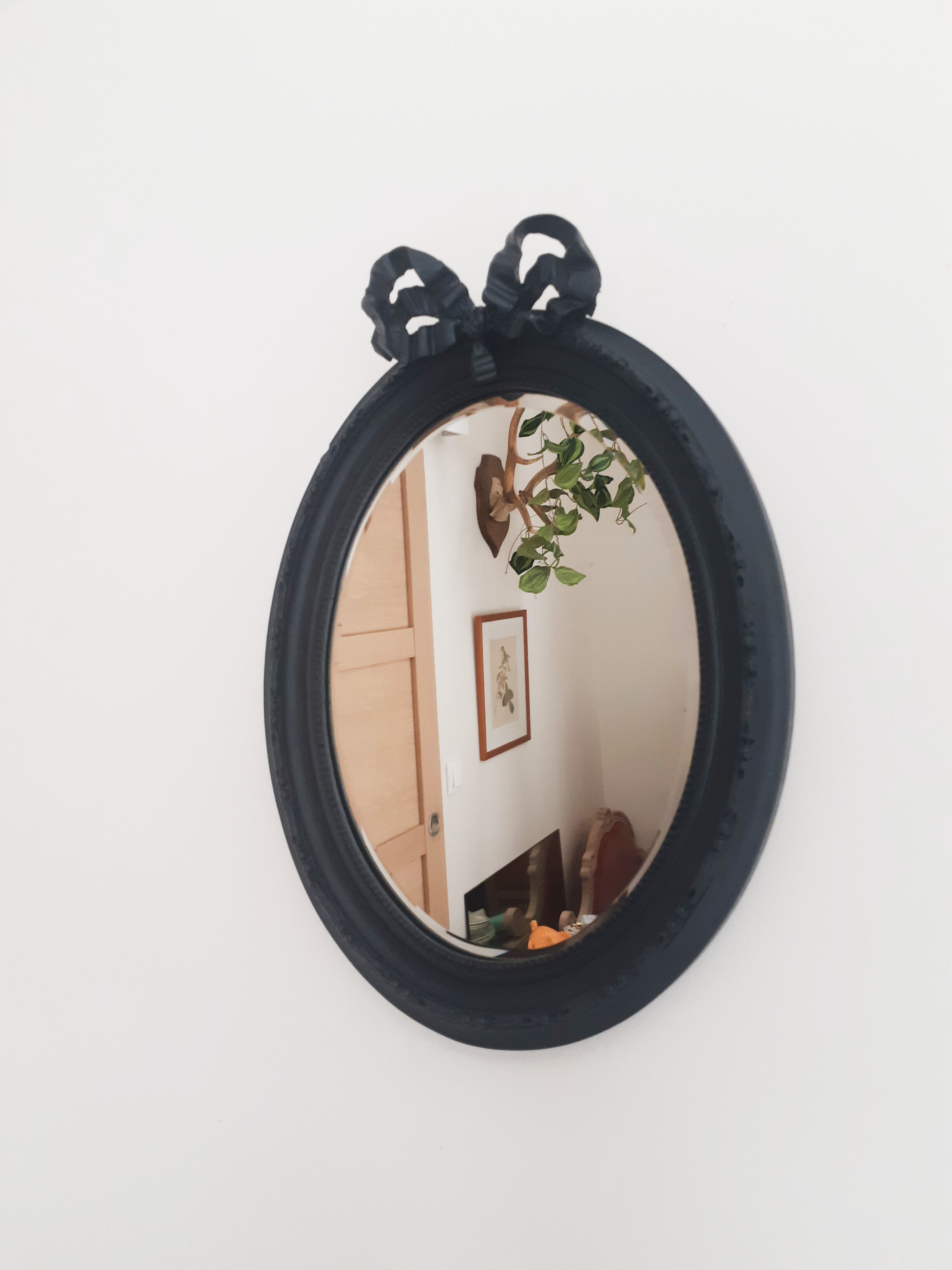 Louis XVI oval mirror with knot, black patinated, vintage
