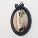 Louis XVI oval mirror with knot, black patinated, vintage