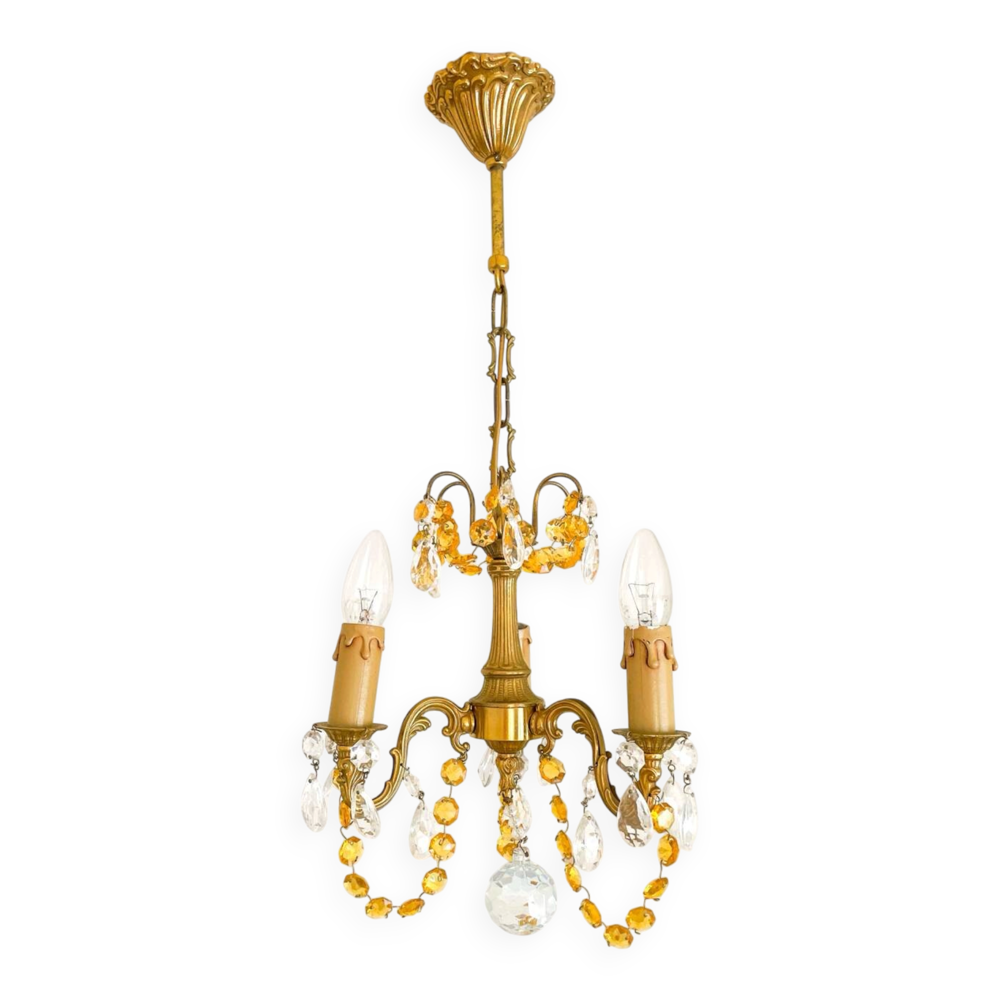 Small vintage brass chandelier with amber crystal pendants.