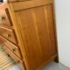 Oak art deco chest of drawers, compass legs