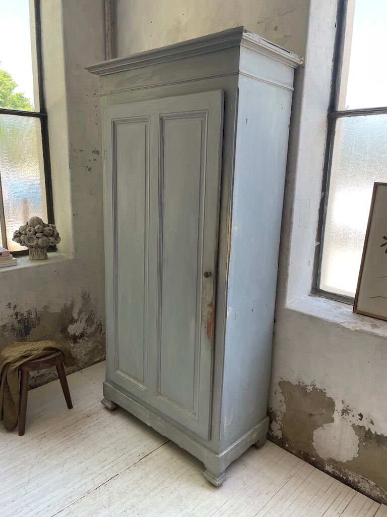 Blue patinated cap cabinet