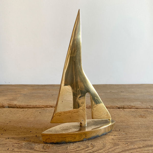 Golden brass sailboat