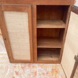 Low cabinet in raw wood and woven raffia