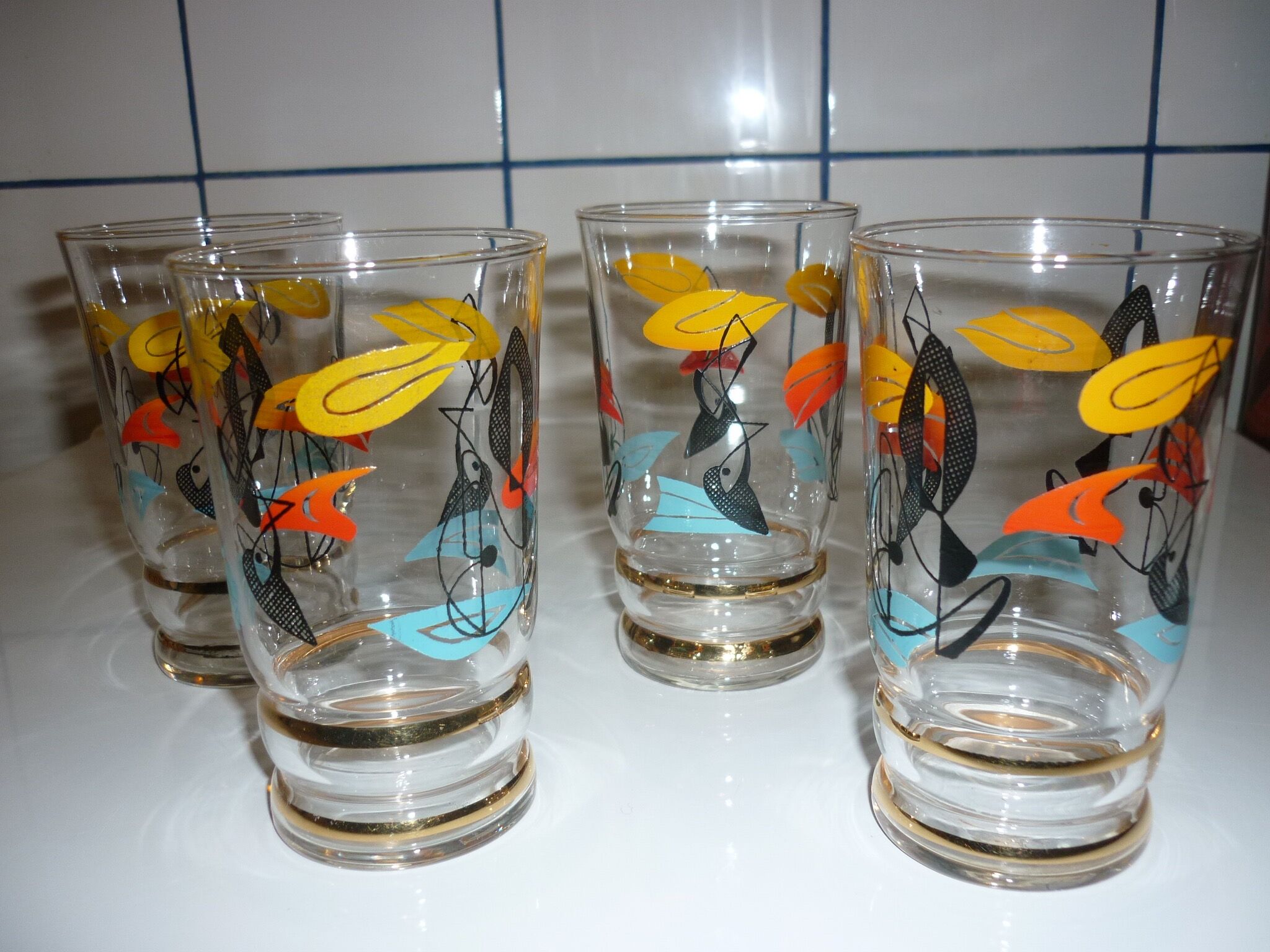 4 juice/water patterns fish colors and gold edges