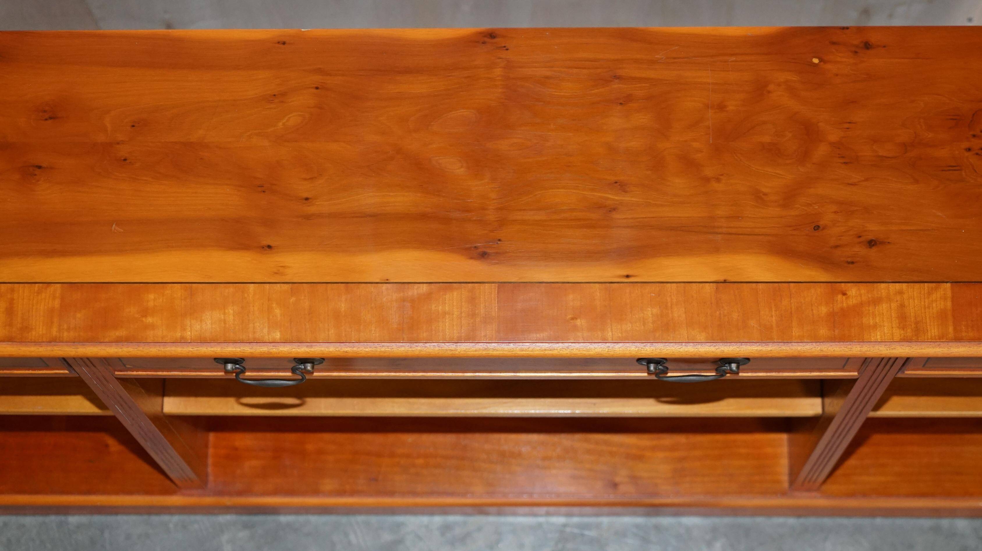 Vintage yew wood library/buffet with three drawers.