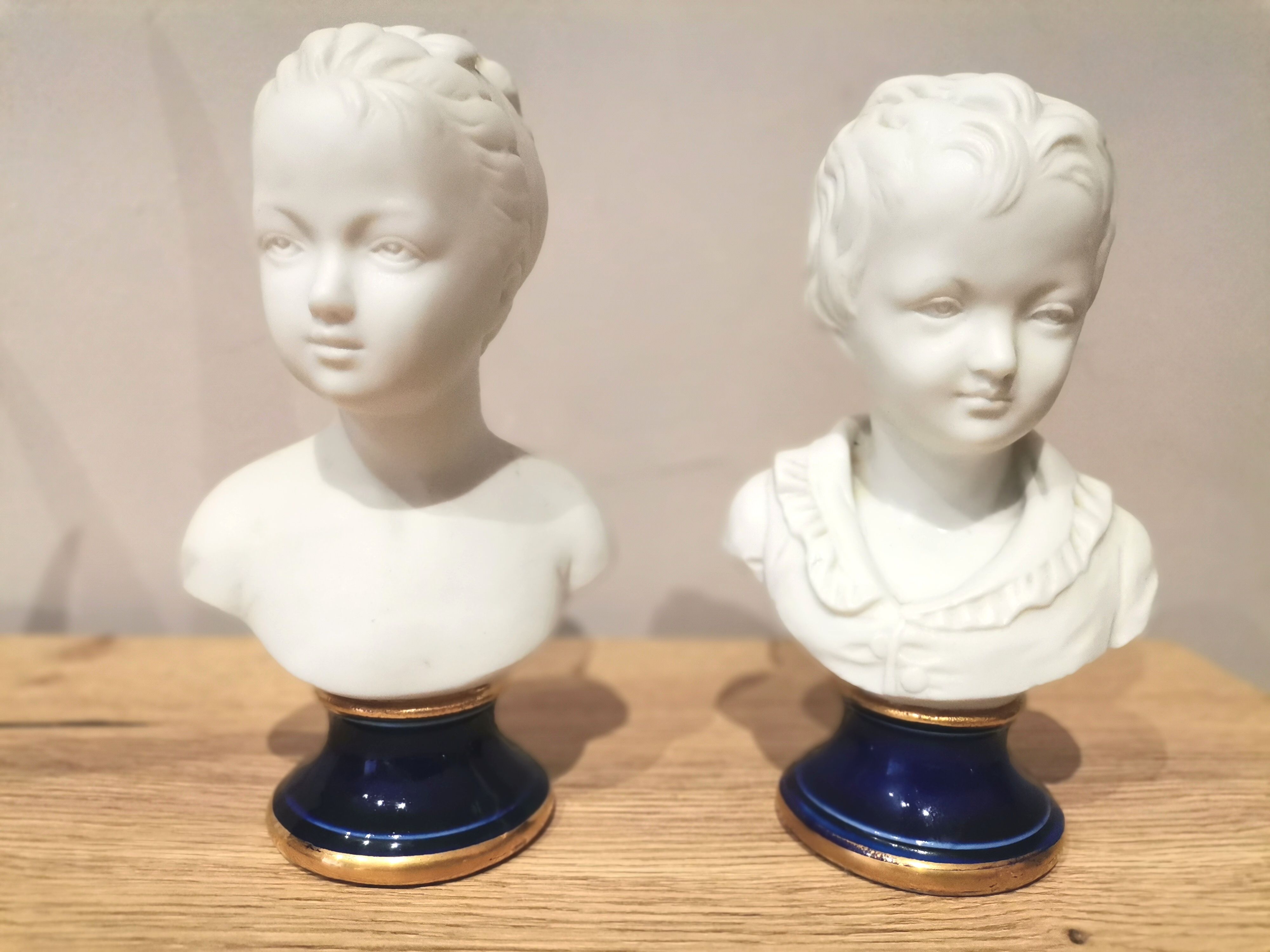 Signed children's busts