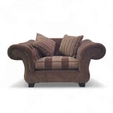 Large weighty love seat with the original matching cushions. Marked "Handmade in Holland"