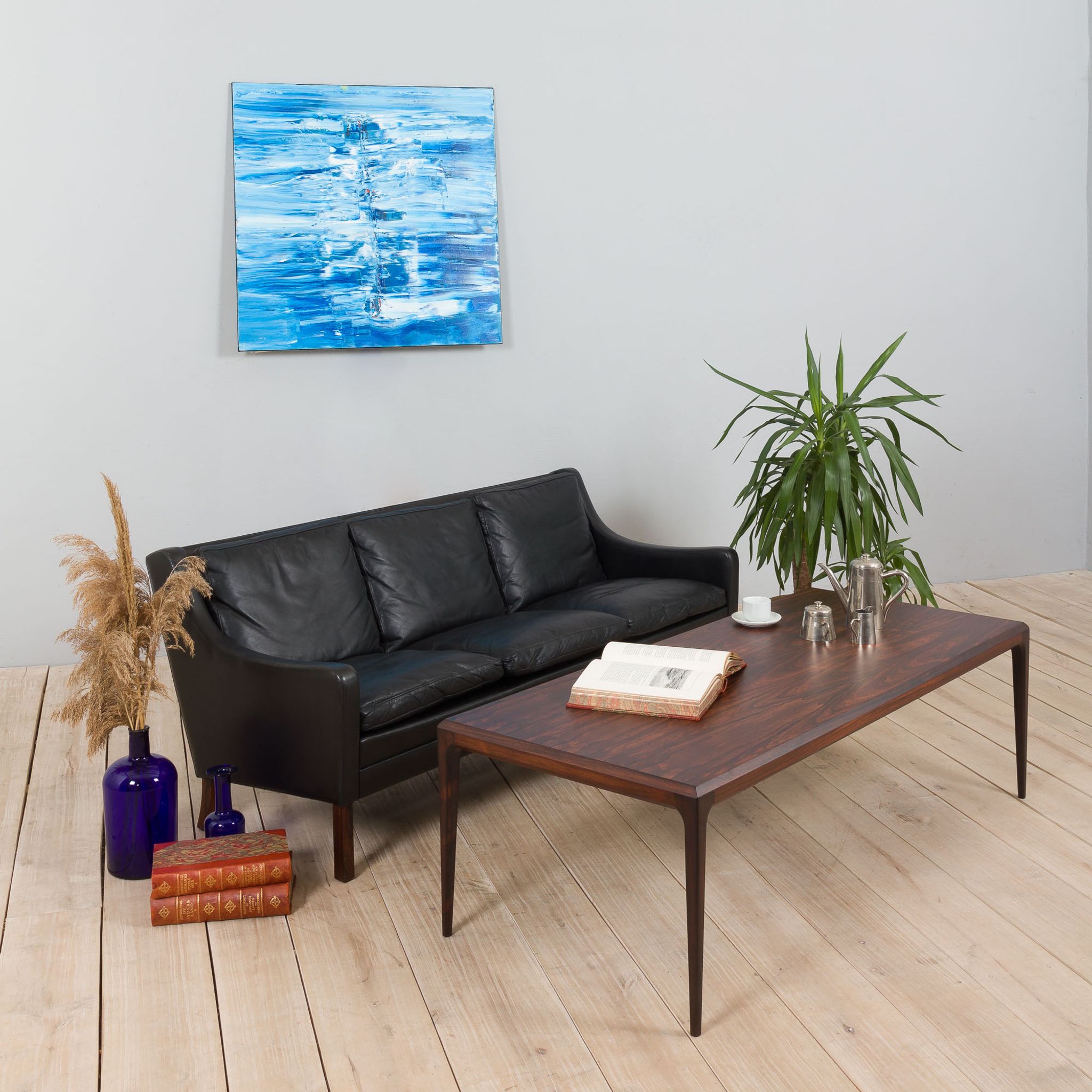 Danish black leather and rosewood sofa