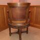 Antique swivel armchair in carved wood and patinated leather – neo-Renaissance style