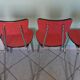 Table in red formica, 4 roc chairs, 2 extension cords, 2 drawers 60