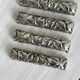 Set of 6 vintage knife rests with bamboo and foliage pattern.