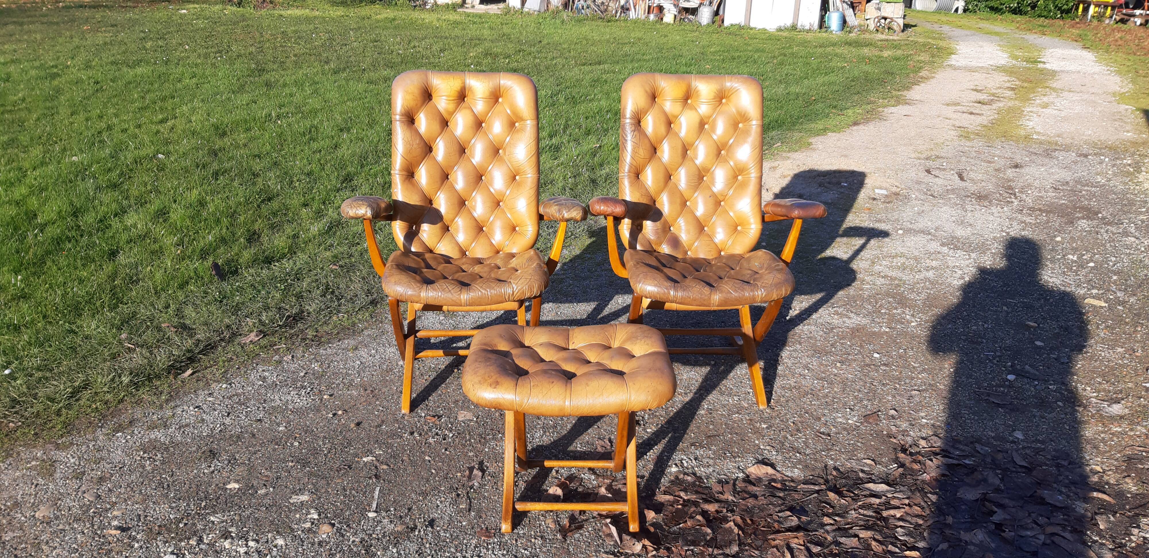 Pair of chesterfield style leather armchairs