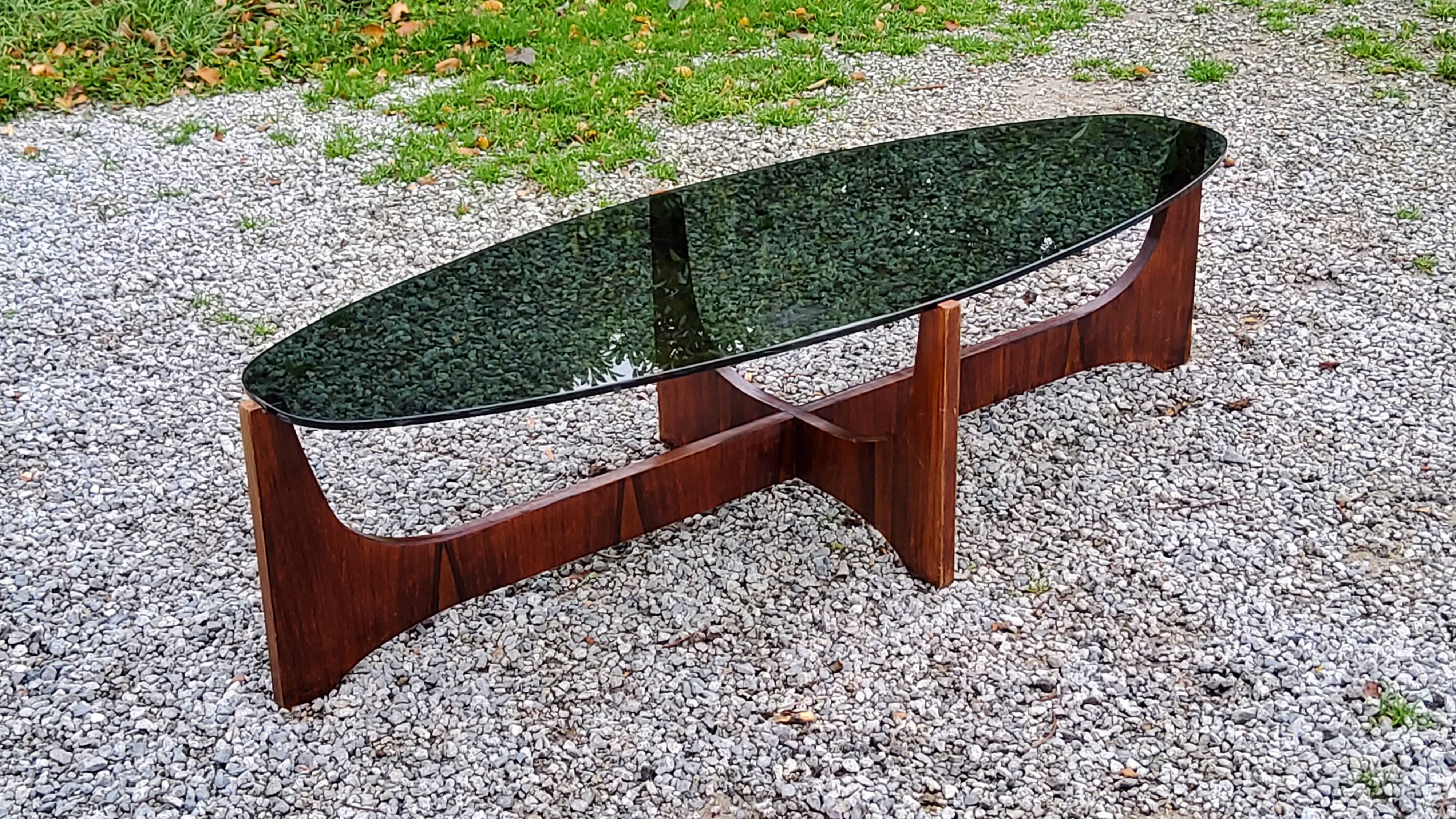 Designer coffee table by Hugues Poignant in rosewood and smoked glass from the 70s