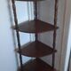 Corner shelf on wooden legs