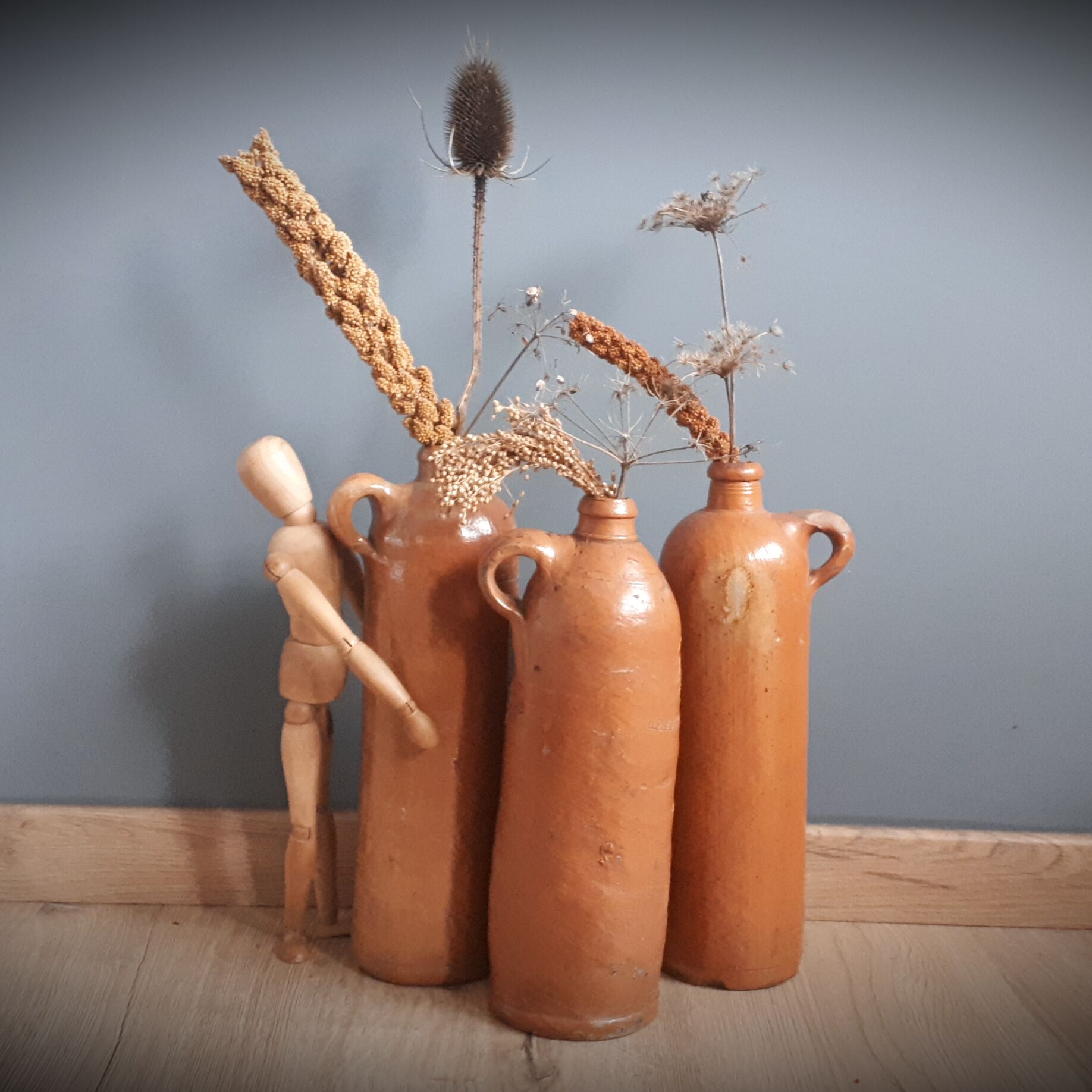 Trio of sandstone bottles